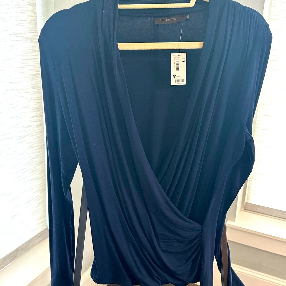 The limited Navy Blue M wrap blouse